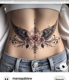 an image of a woman's stomach with roses and wings on the side,