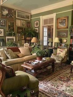 a living room filled with furniture and pictures on the wall