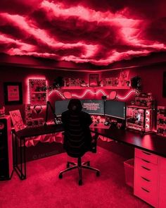 a room filled with lots of computer equipment and red clouds in the sky above it