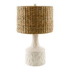 a white table lamp with a woven shade on it's base and wicker lampshade