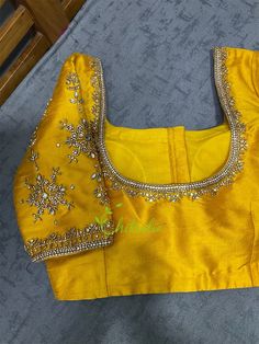 This is made to order/ custom made according to your requirements. Fabric - High quality rawsilk Color - Flaming Yellow Princess Cut Padded Deep U Front and Back Neck Front Hook Closure Half Sleeve Cotton lining This flaming yellow choli blouse is perfect for haldi ceremony. It's embellished with kundan stones and beads. Size : 32, 34, 36, 38, 40, 42 44 all sizes possible This is made to order product. We will send a measurement template once you purchase the item. You can provide measurements l Cheap Yellow Blouse Piece For Puja, Bollywood Style Yellow Blouse For Wedding, Bollywood Style Yellow Wedding Blouse, Traditional Yellow Blouse For Wedding, Yellow Blouse For Wedding And Navratri, Festive Yellow Blouse For Wedding, Festive Yellow Wedding Blouse, Fitted Yellow Blouse Piece For Wedding, Yellow Tops For Diwali Wedding