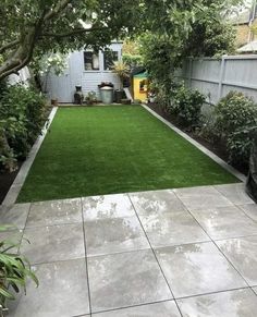 a backyard with grass and trees in the background