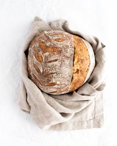 a loaf of bread sitting on top of a cloth