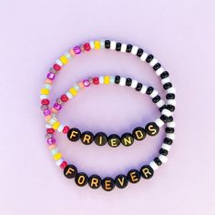 two bracelets with beads that say friends forever