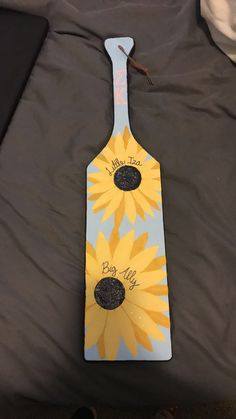 a wooden board with sunflowers painted on it and the words, you are my sunshine