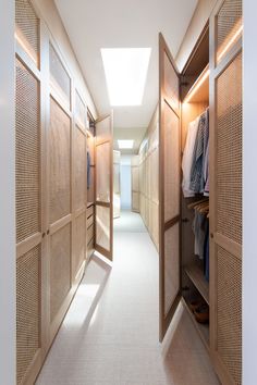 an empty walk in closet with wooden doors