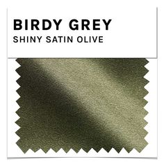 an image of shiny satin fabric with the words birdy grey in black and white