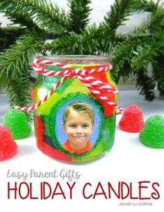 a glass jar filled with candy canes next to christmas decorations