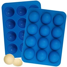 two blue trays filled with golf balls next to each other