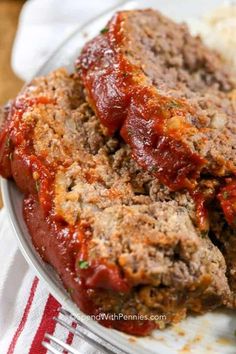 meatloaf with sauce and rice on a plate