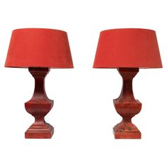 two red lamps sitting next to each other