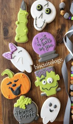 some decorated cookies are sitting on a table