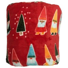 a red pillow with gnomes and trees on it