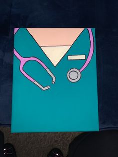 a card with a stethoscope on it sitting next to someone's feet