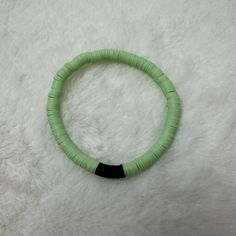 Custom-crafted bracelet featuring light green and black heishi clay beads on a stretchable band. Size of bracelet in photo: 7 1/2 inches Bracelets Clay, Clay Bead Bracelets, Heishi Bracelets, Clay Bead Bracelet, Clay Bracelet, Clay Bead, Tie Styles, Stackable Bracelets, Heishi Beads