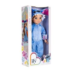 the doll is in its box and it's wearing a blue animal suit with flowers on