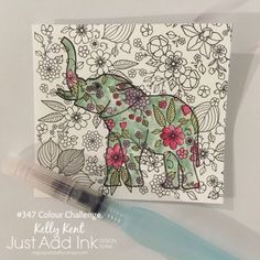 an elephant with flowers on it is next to a pen and paper that says just add ink