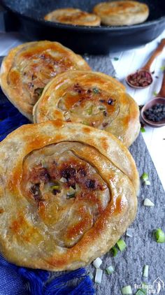 three homemade spiced beef flatbreads on a table