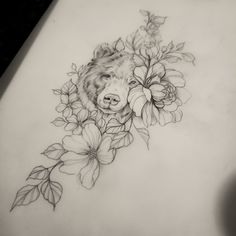 a drawing of a bear with flowers on it's head and behind its ear