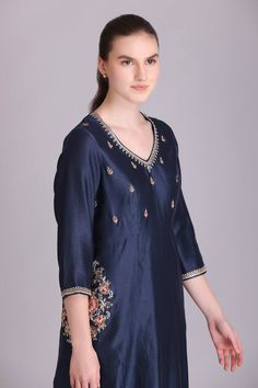 Blue kurta with sequins embroidery on front, back and side pockets. Paired with a plain red straight pant with scalloped hem and embroidered dupatta with tassels on hem. - Aza Fashions Festive V-neck Sets With Floral Embroidery, V-neck Kurta With Resham Embroidery For Festive Occasions, Festive V-neck Kurta With Resham Embroidery, V-neck Anarkali Set With Resham Embroidery, V-neck Palazzo Set With Resham Embroidery For Festivals, Diwali V-neck Palazzo Set With Zari Work, V-neck Palazzo Set With Zari Work For Diwali, Floral Embroidered V-neck Kurta For Wedding, Traditional Blue V-neck Blouse Piece