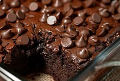 a close up of a cake with chocolate chips on it