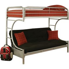 a futon bunk bed with red and black pillows on it, next to a backpack