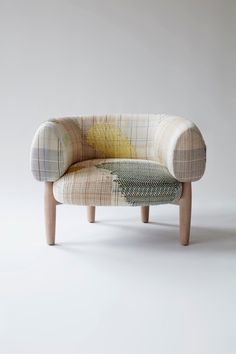 an upholstered chair with different patterns on it