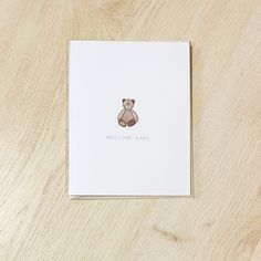 a welcome baby card with a teddy bear on it