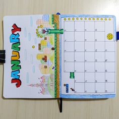 an open planner book with the words happy birthday written in bright letters on it, sitting on a table