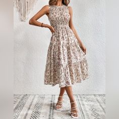 New Boho Floral Smocked Tiered Ruffle Midi Dress * Sleeveless * Stretch Smocked Top * Ruffle Trim Round Neck * High Waist * Tiered Ruffle A Line Flare Skirt * Unlined *Approximate Unstretched Measurements* Small (4) * Bust 27.5"(Up To 35.25") * Waist 25.25"(Up To 27.5") * Length 45.75" Medium (6) * Bust 29"(Up To 37") * Waist 26.75" (Up To 29") * Length 46.5" Large (8/10) * Bust 31.5"(Up To 39.5") * Waist 29" (Up To 31.5")* Length 47.25" Xl (12) * Bust 34" (Up To 41.75") * Waist 31.5"(Up To 34") Sleeveless Smocked Sundress With Elastic Neckline, Spring Sleeveless Smocked Dress With Ruffles, Fitted Sleeveless Smocked Dress With Elastic Neckline, Chic Sleeveless Sundress With Elastic Neckline, Sleeveless Smocked Floral Dress For Beach, Sleeveless Floral Print Smocked Dress For Beach, Sleeveless Smocked Dress With Floral Print For Beach, Sleeveless Smocked Ruffle Dress For Vacation, Fitted Sleeveless Smocked Dress For Spring