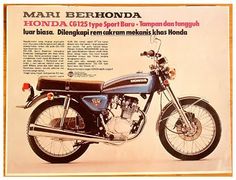 an advertisement for a motorcycle with the words honda on it's front tire arch