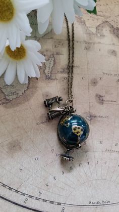 The teacher or traveler in your life will get a kick out of this necklace. It features a 1 1/2" long metal globe pendant that dangles from an antique bronze 30" chain. It is embellished with a metal heart charm and a metal pair of binoculars charm. The chain has a 3" extender making the overall length quite versatile. Welcome to Recycled Finery!  I repurpose old jewelry, coins, beads, vintage buttons, watch parts, and charms into new jewelry.  My ever-growing collection of these materials comes Geography Gifts, Geography Teacher, Globe Necklace, Teacher Birthday Gifts, World Globe, Watch Parts, Metal Heart, Gift For Teacher, Globe Pendant