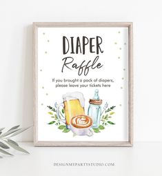 a framed sign that says, diaper raffe if you brought a pack of diapers please leave your tickets here