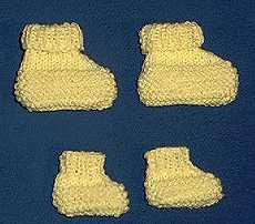 four pairs of knitted shoes are shown on a blue surface with white stitchs