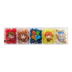 an assortment of candy candies with cartoon characters in plastic containers on a white background