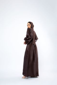 The Organza Abaya is statement outfit for any event. It's super lightweight yet so simple with the prettiest sheen. Complete the look with our matching long sleeve satin slip dress and a pair of strappy heels for a luxe finish or make it into a more casual look. *Please note that the color displayed in the picture might be slightly different due to the color resolution and lighting. Fabric Description & Care: Balloon Sleeves with elastic cuff Double Lined Material: Silk/Organza Dry Clean for bes Organza Abaya, Lighting Fabric, Statement Outfit, Cocoa Brown, Silk Organza, Satin Slip, Satin Slip Dress, Balloon Sleeves, Strappy Heels