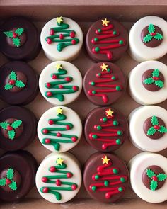 a box filled with lots of decorated donuts