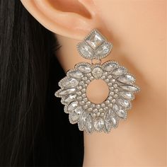 Elegantly elevate your ensemble with these dazzling, artistic earrings that boast a shining silvertone finish and sparkling crystal accents. 1.96'' W x 2.56'' L Silvertone copper / cubic zirconia / genuine crystal Artistic Earrings, Sparkling Crystal, Ear Cuff, Silver Plate, Diamond Earrings, Silver Plated, Cubic Zirconia, Silver Tone, Copper