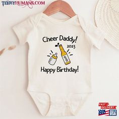 a baby bodysuit with the words cheer daddy, happy birthday on it and a bottle of beer