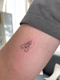 a person with a small tattoo on their arm