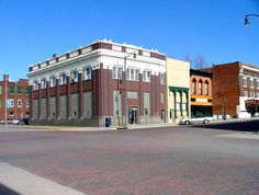 an empty street in front of some buildings