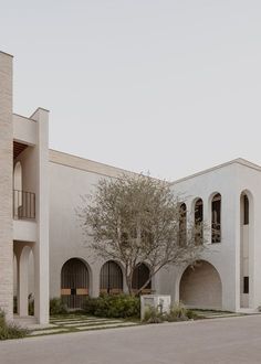 a large white building with arched windows and balconies