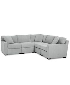 a large sectional couch sitting on top of a white floor