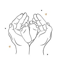 two hands are holding the baby's feet with hearts around them on a white background