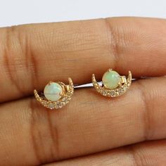 Delicate 14K Yellow Gold Studs, Mini Gemstone dainty Studs, Dainty Single Dot Studs, Natural Fire Opal Studs, Product info:14k solid goldwhite diamonds, I color, SI claritywhite diamonds - 1 mm, I, SI clarityOpal: Ethiopian Natural, 4mmStud Size: 10 mmItem will be resized and shipped within 10 days.ITEM Will BE SHIPPED : India Speed PostTo get the item in 4-5 days, we can also ship it thru DHL express, please contact us before.Please select your size at the drop down menu.Thanks!♥Shipping Policy Elegant Crescent Shaped Birthstone Jewelry, Elegant Crescent Birthstone Jewelry, Elegant Crescent-shaped Birthstone Jewelry, 14k Gold Crescent Earrings For Anniversary, 14k Gold Crescent Pierced Jewelry, 14k Gold Crescent Shaped Pierced Jewelry, Gold Plated Crescent Jewelry For Anniversary, Celestial Yellow Gold Jewelry With Matching Earrings, Gold Crescent Gemstone Jewelry