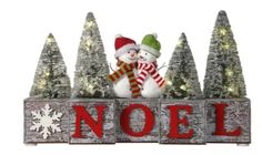 a wooden noel sign with snowmen and trees