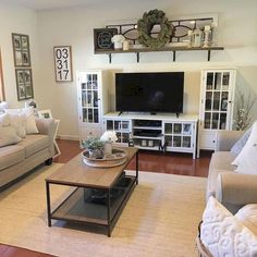 a living room filled with furniture and a flat screen tv