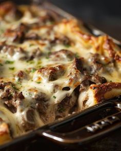 a casserole dish with meat and cheese on it is ready to be eaten