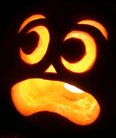 a carved pumpkin with an angry face on it