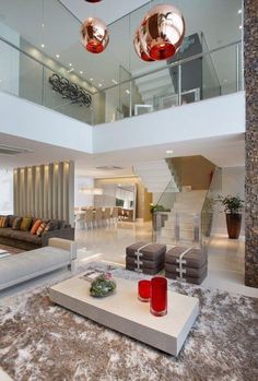 modern living room with high ceilings and glass railings